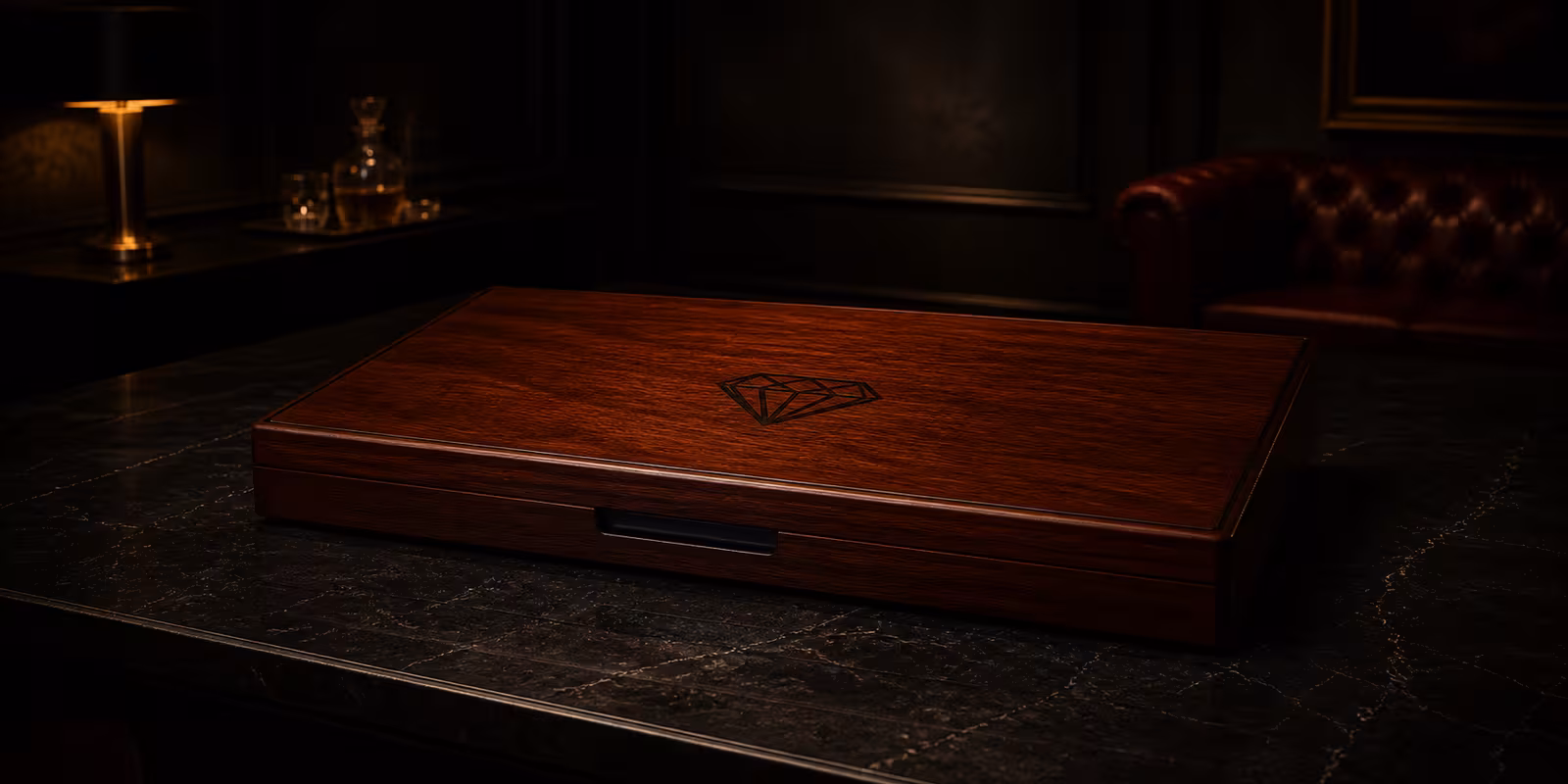 Slim closed mahogany presentation case with a black diamond motif burned into its lid in an elegant wide private salon setting